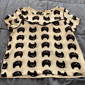 White with black cats shirt
